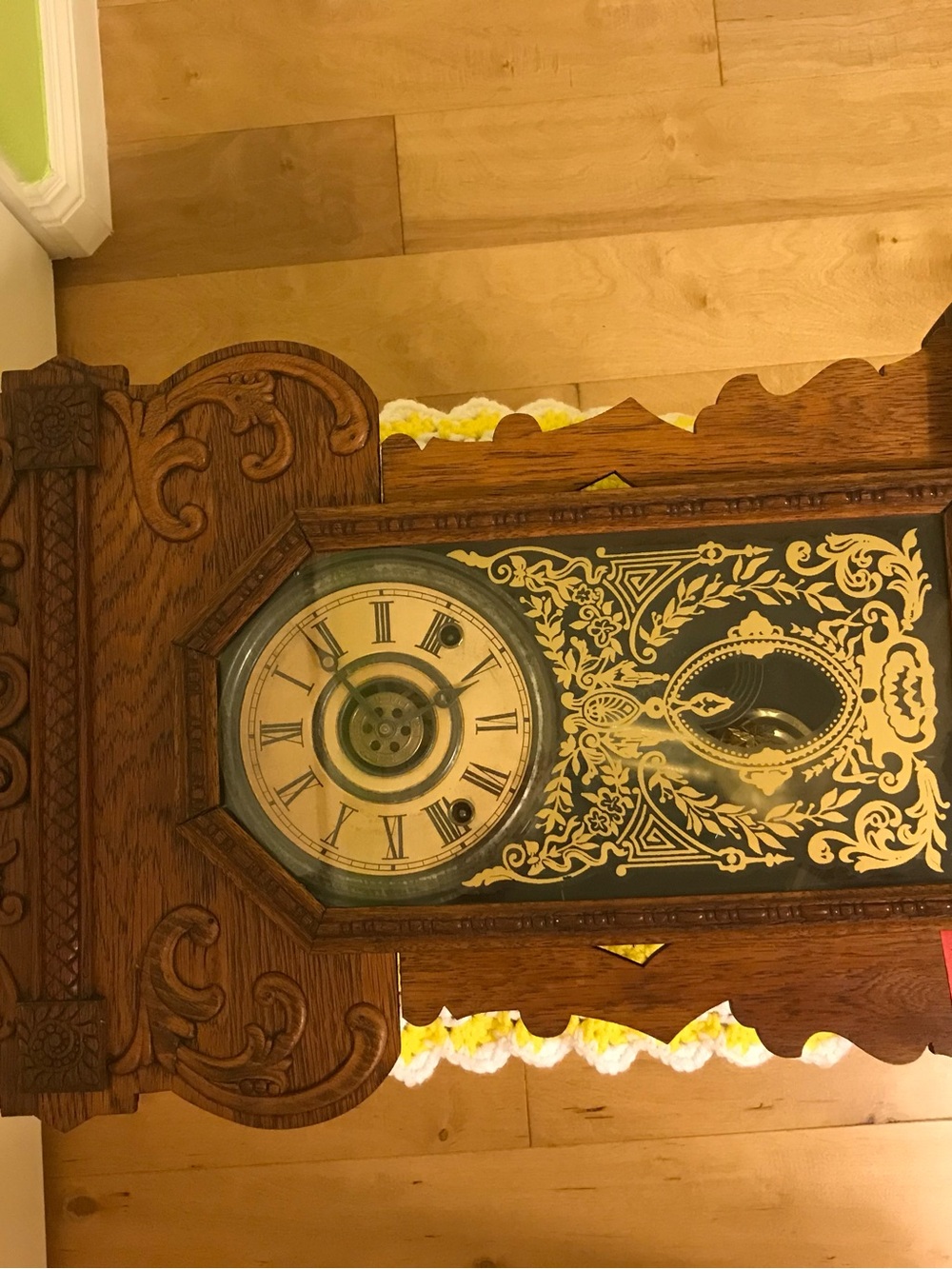 Ornate Wooden Wall Clock with Gold and Black Detailing